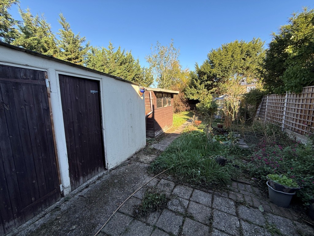 Lot: 164 - TWO-BEDROOM SEMI-DETACHED HOUSE FOR IMPROVEMENT AND REPAIR - Rear Garden with outbuildings and shed
